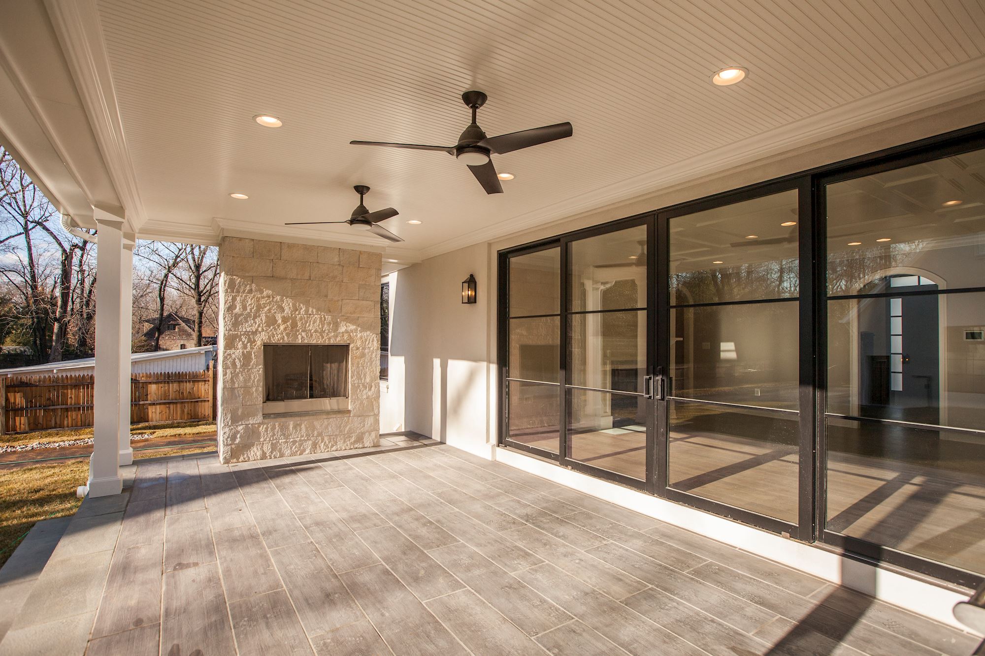 Covered porch with outdoor fireplace — outside living, twelve months a year