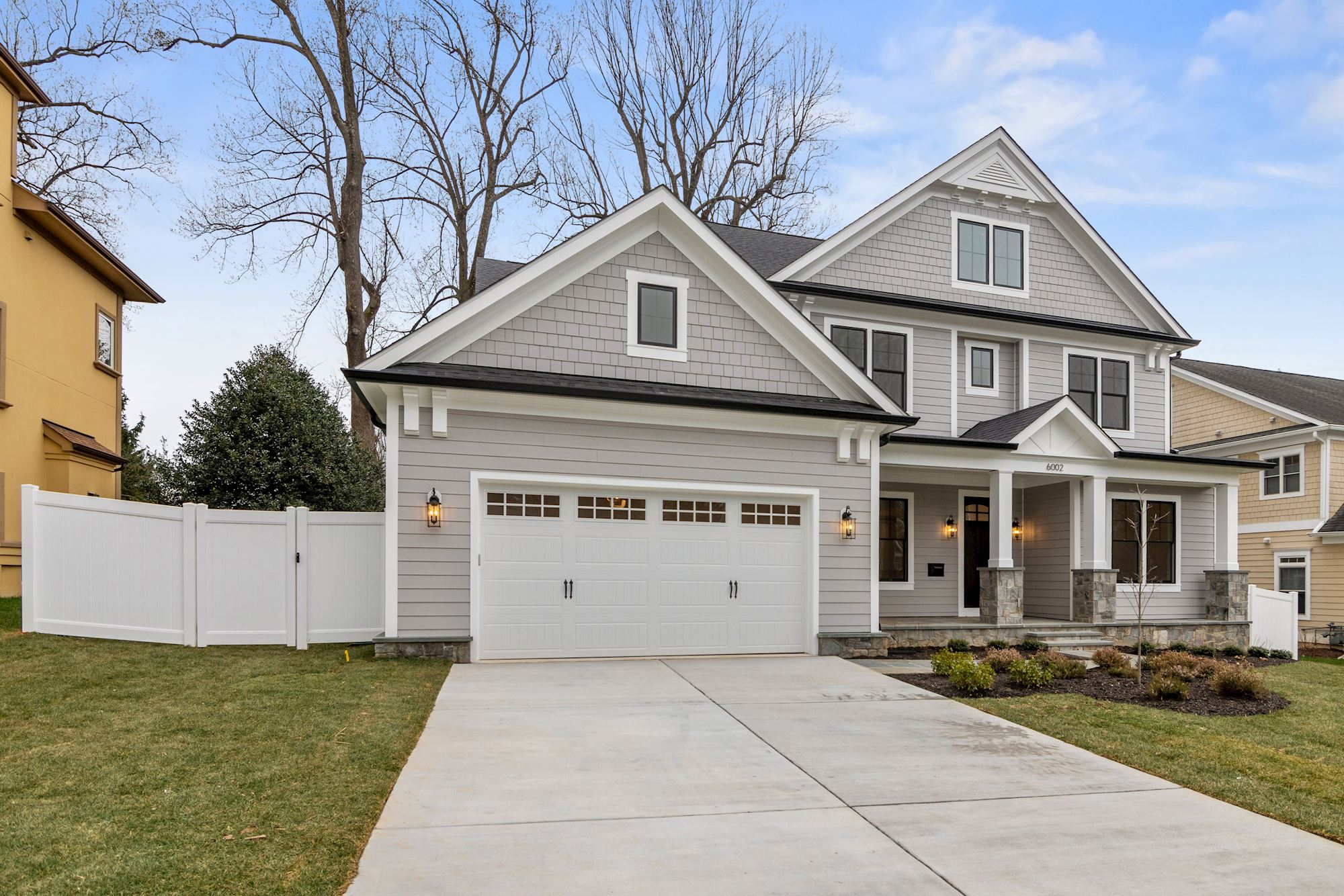 Two-car garage, covered entry, one address worth finding.