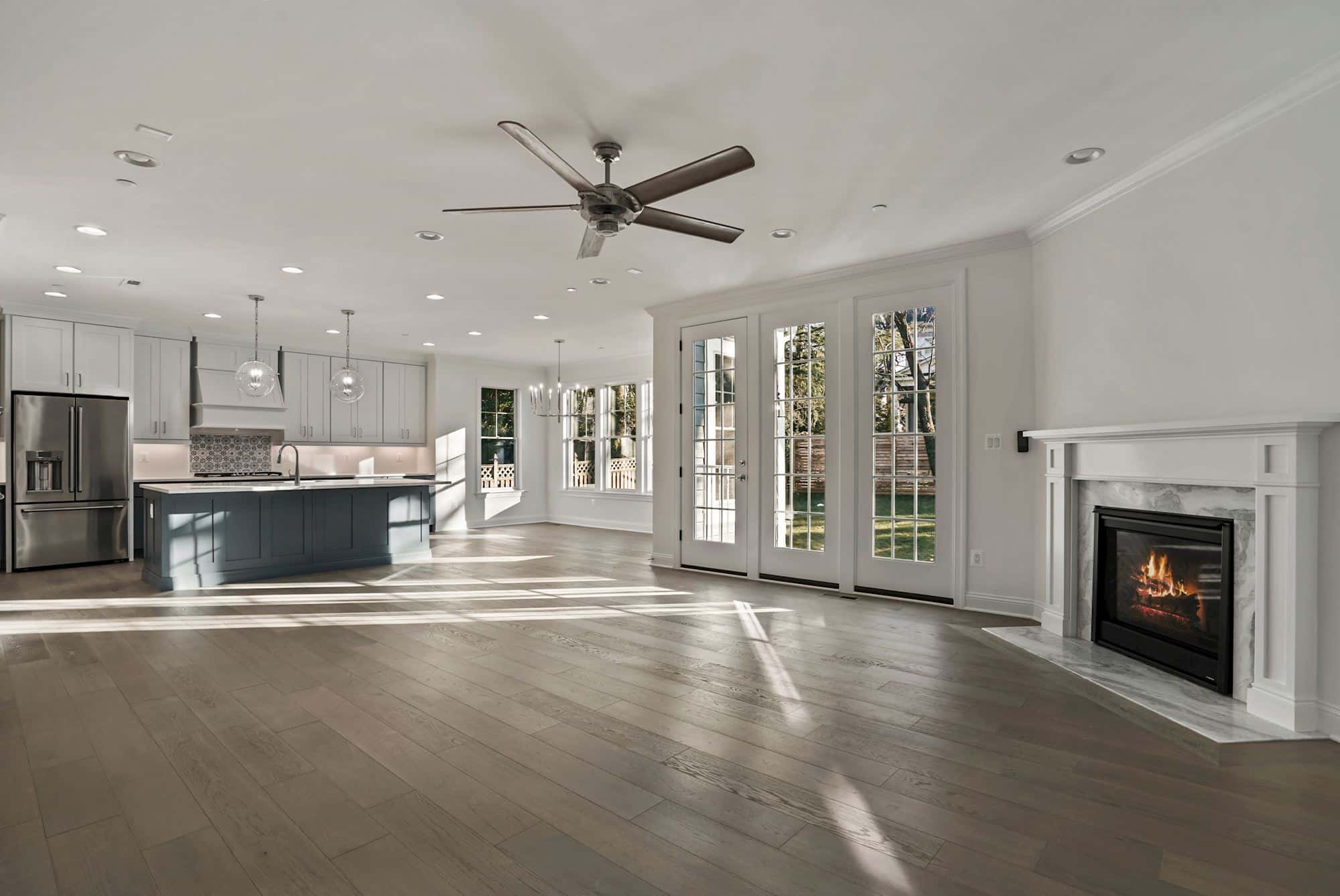 Open plan that breathes from kitchen to hearth.