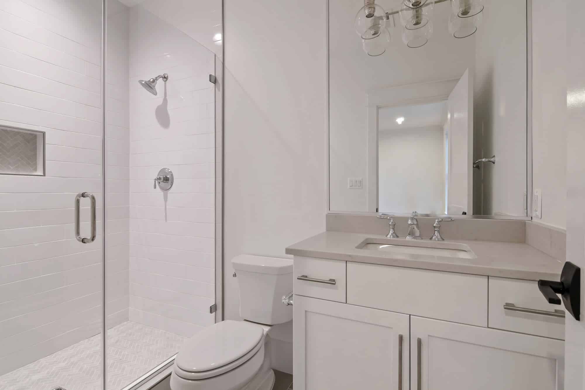 Glass door, recessed niche, a quick rinse becomes a ritual.