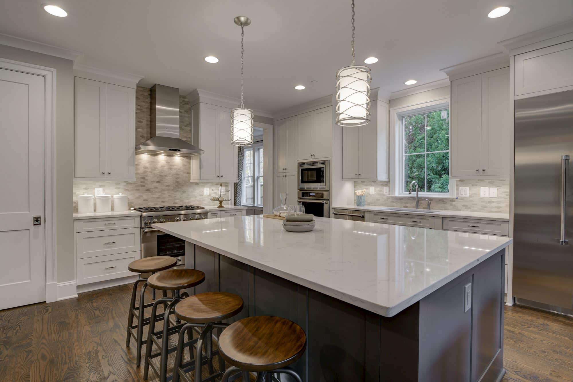 Recessed light, pendant glow, the counter invites you to stay.