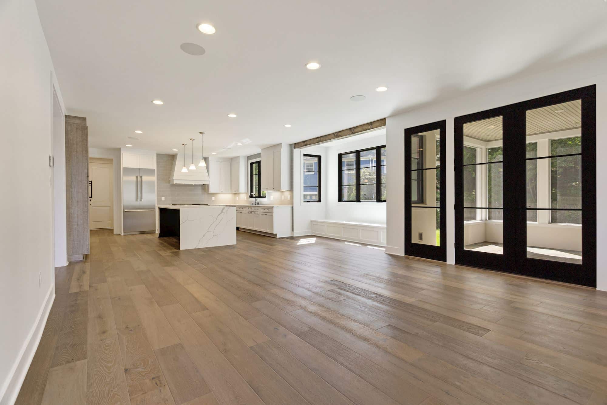 Open-plan living flows seamlessly into a bright, modern kitchen.