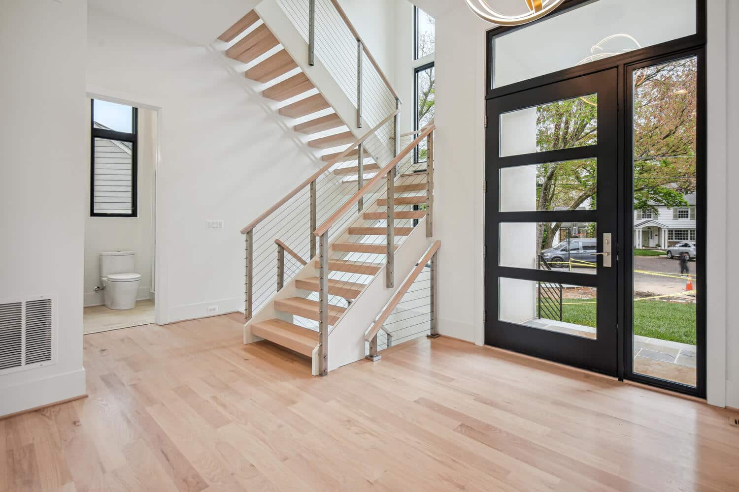 Open treads, cable rails u2014 the staircase disappears into light