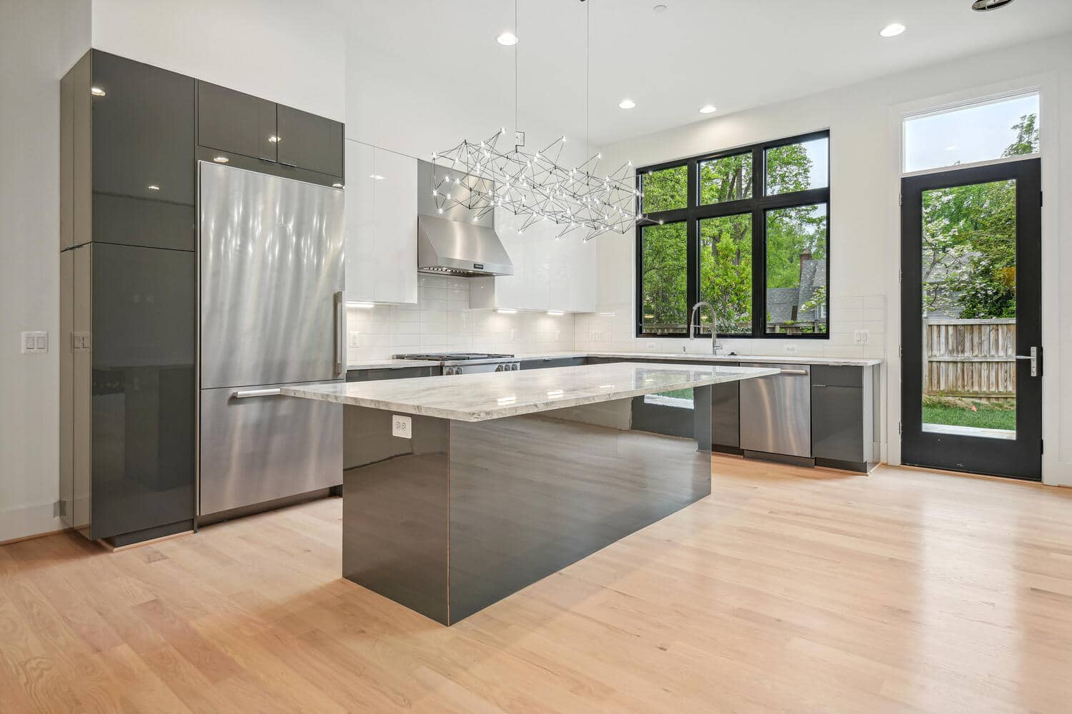 Refrigerator columns flush with cabinetry u2014 function hidden in plain sight