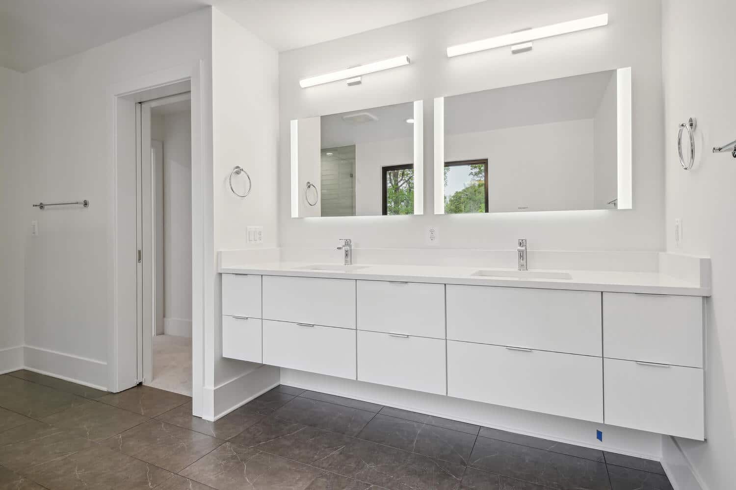 Two sinks, one long mirror, morning runs smoothly