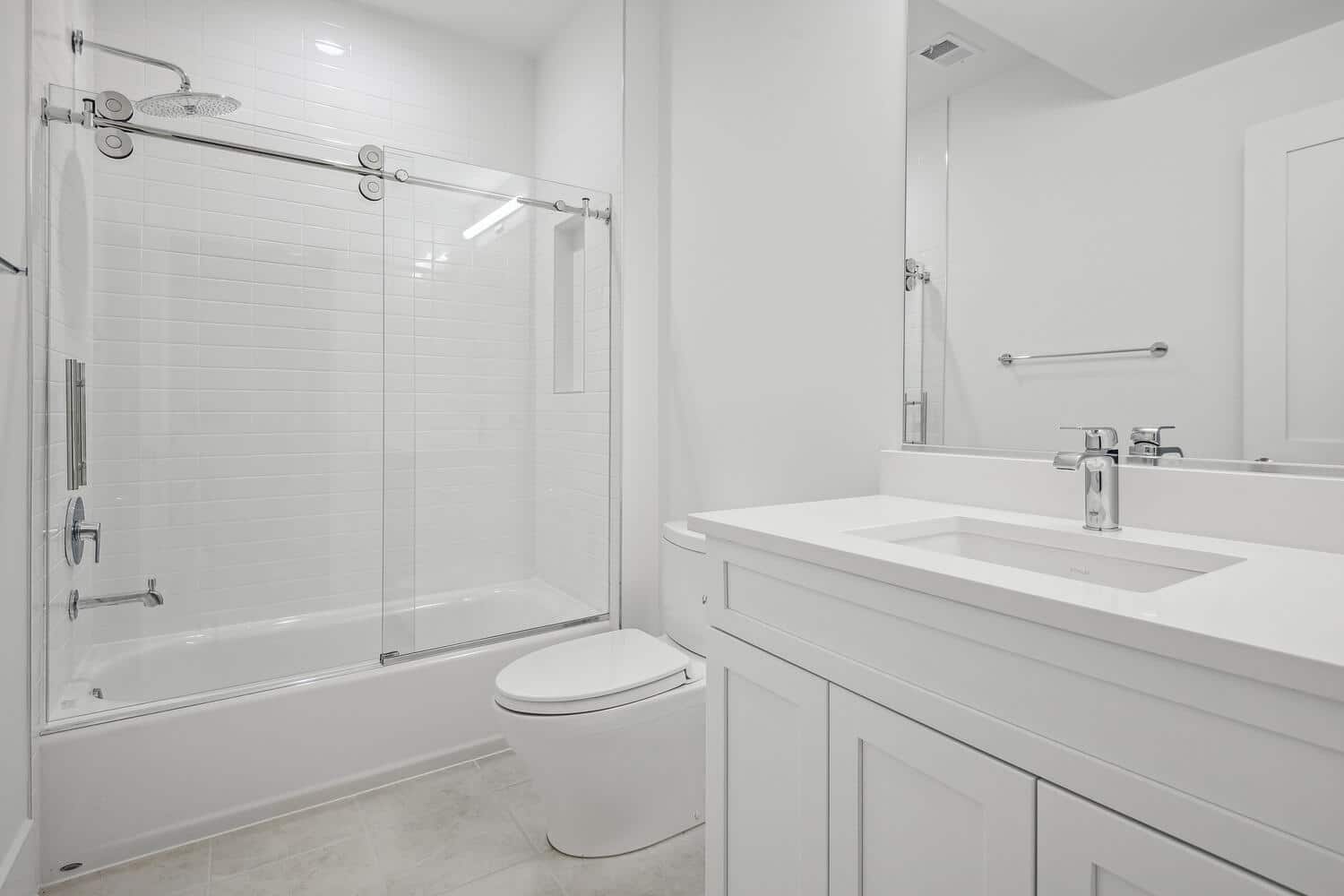 Glass slides open, chrome gleams, the tub waits
