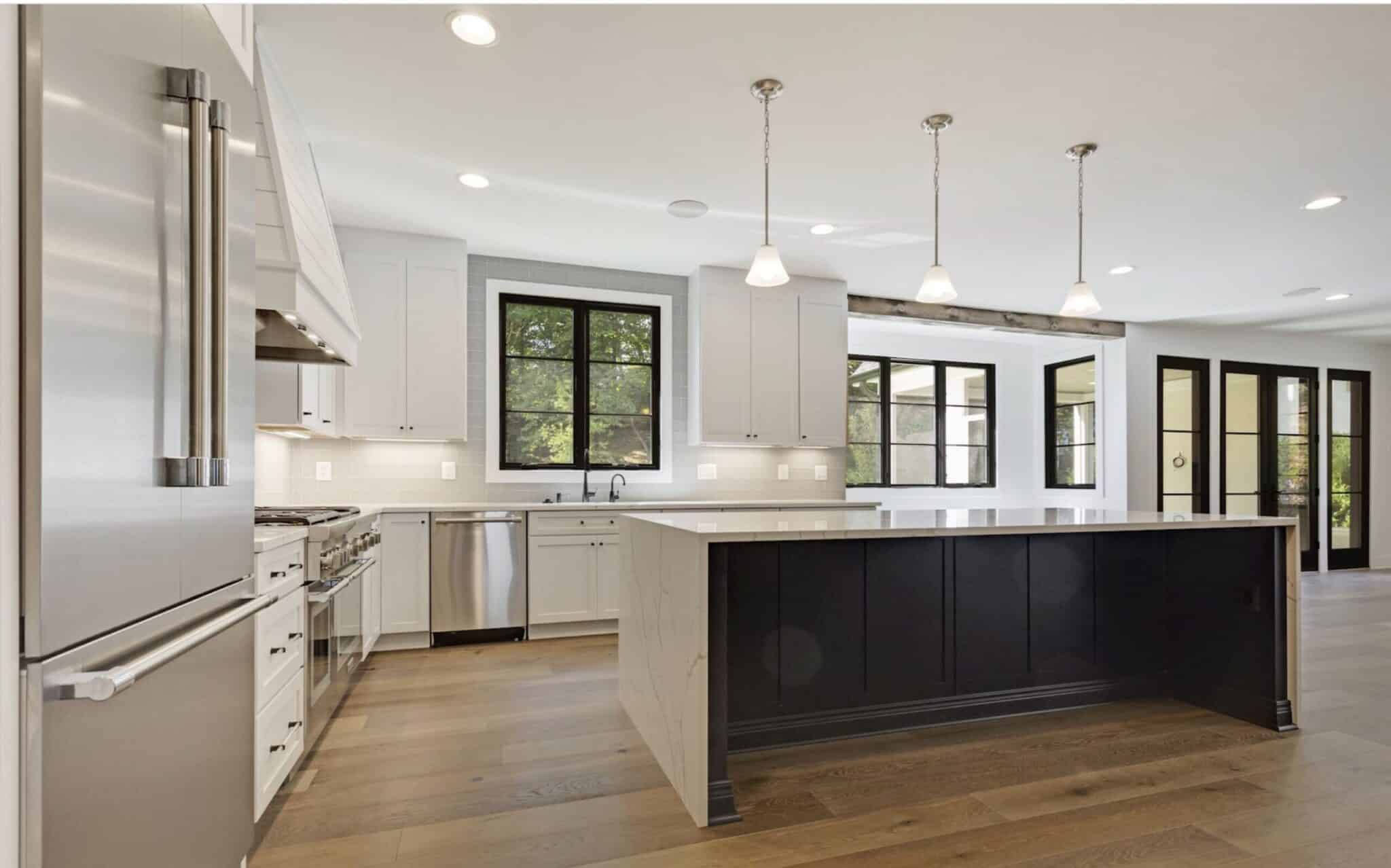 Pro range, oversized island, the kitchen runs the house.