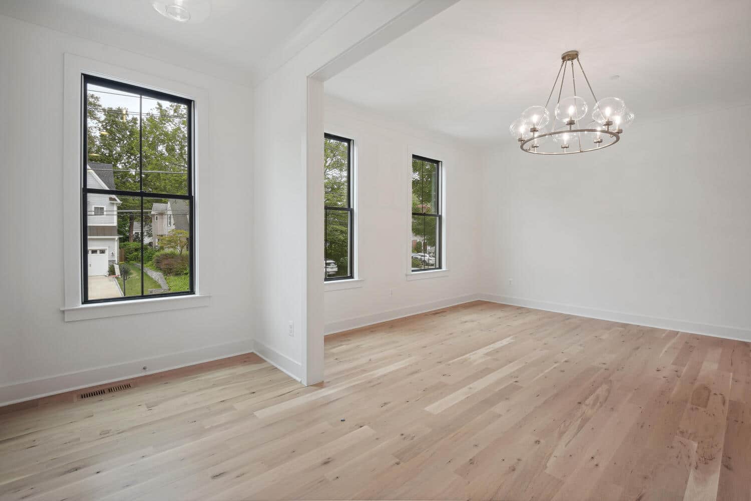 High ceilings, wide planks, room scaled for gathering.