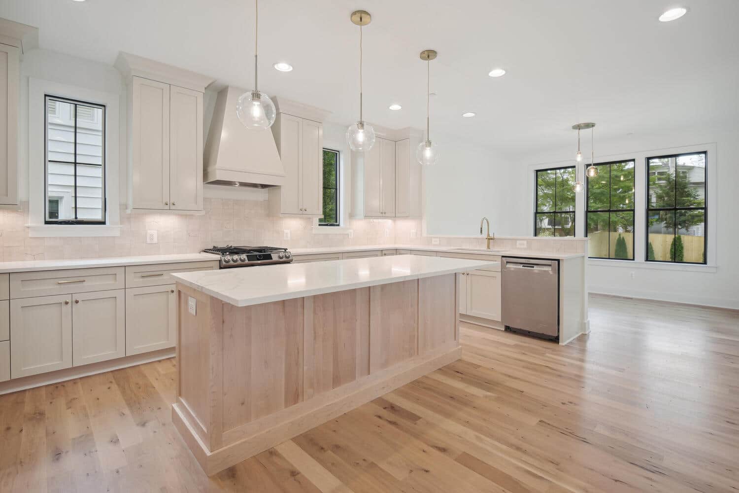 Pendants drop low, counter runs long, prep flows easy.