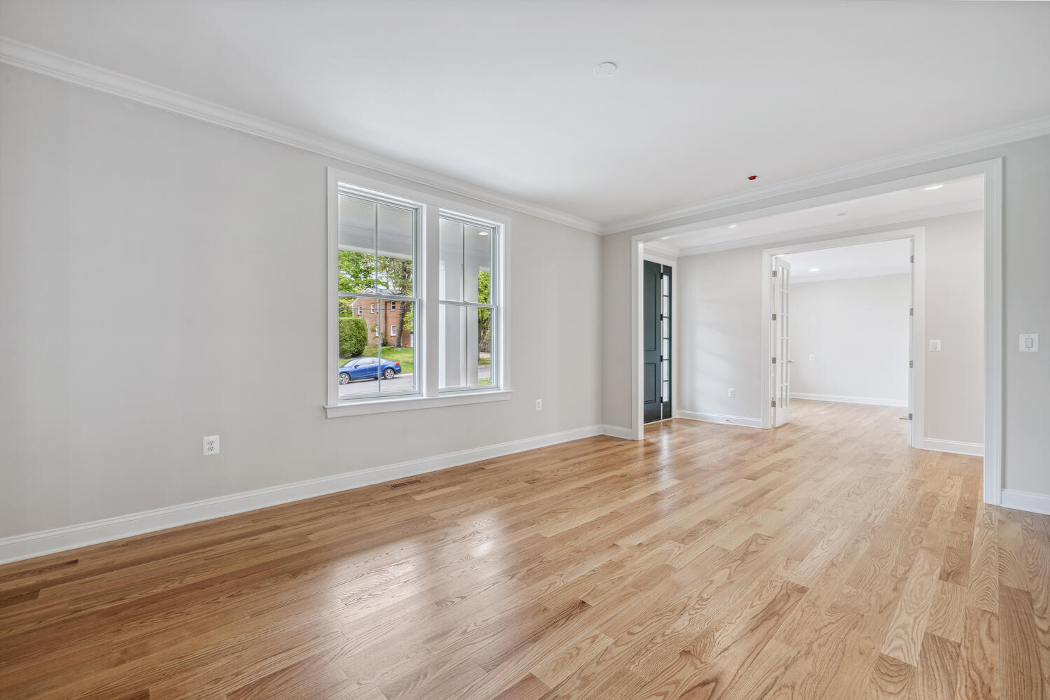 Open to the entry, the room invites before you unpack.