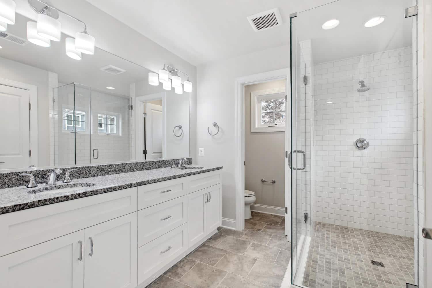 Glass enclosure, double vanity, private water closet