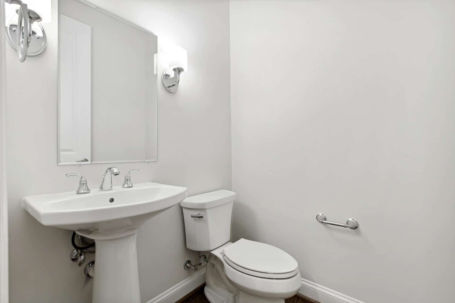 Pedestal sink, sconce light, compact and complete