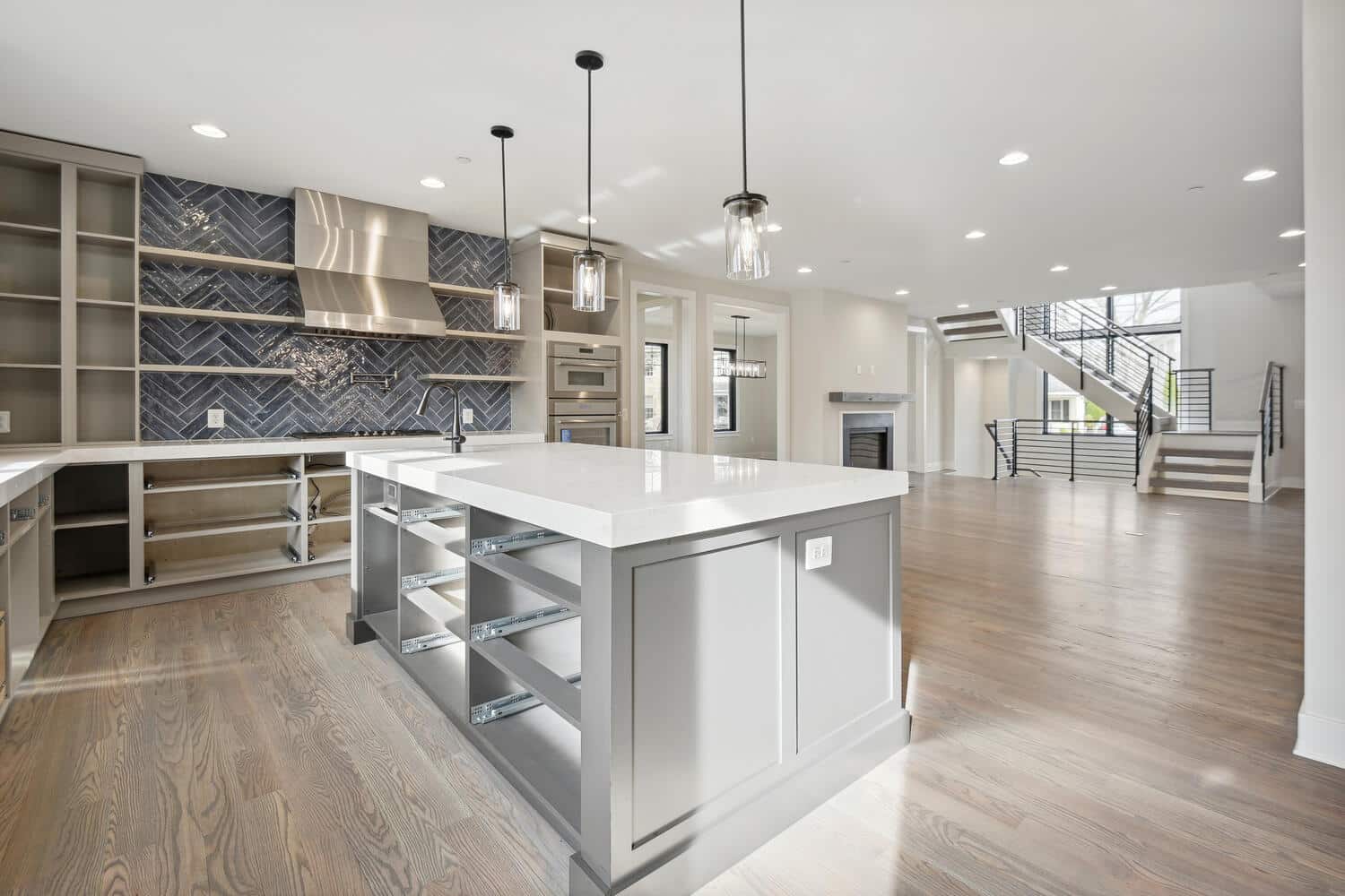 Herringbone tile pulls the eye straight to the range.