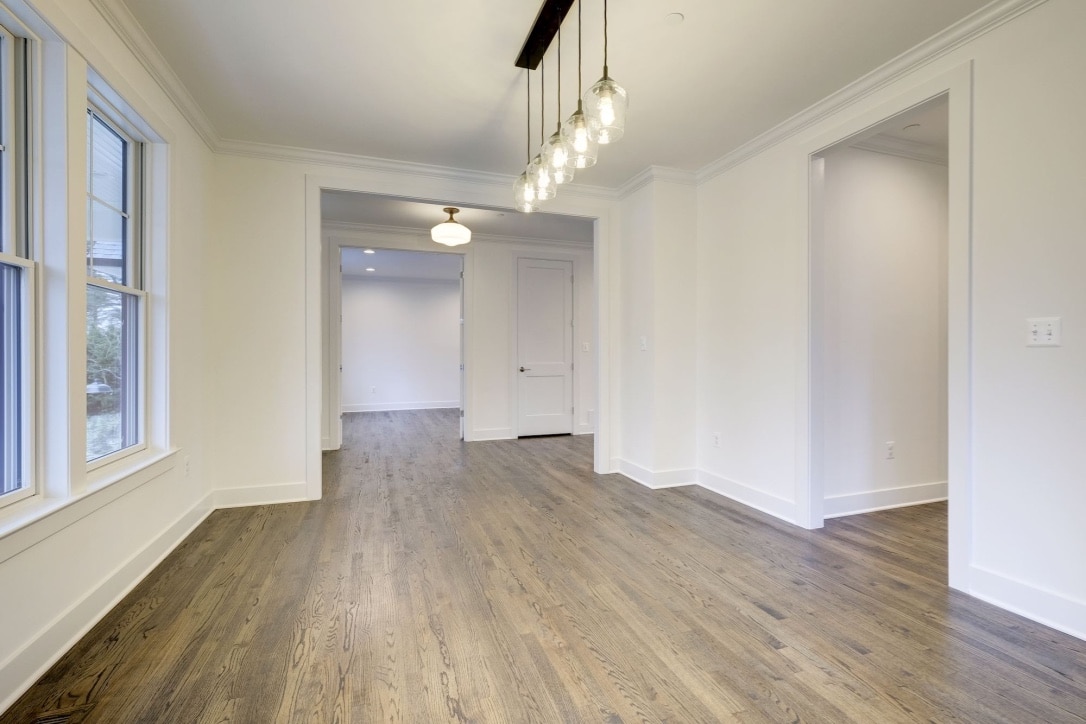 High ceilings, low pendants, room sized for real dinners.