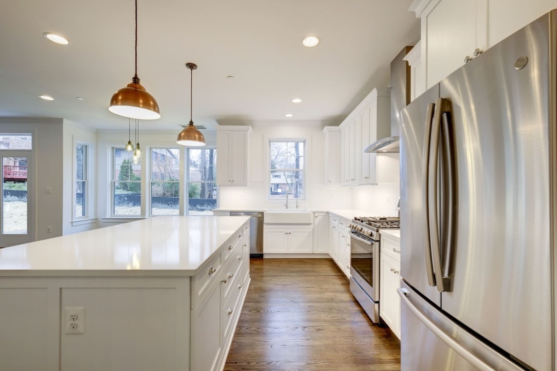 Island anchors the room, appliances disappear into the work.