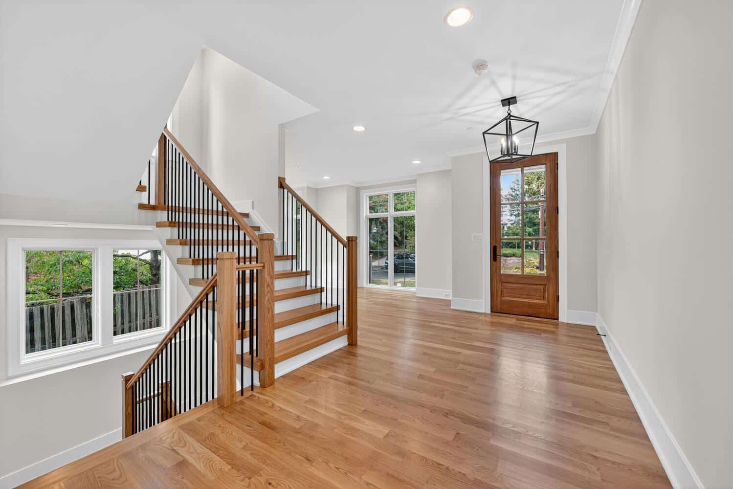 Window-lit hallway, not a dark hall. Every space here was drawn with intention.