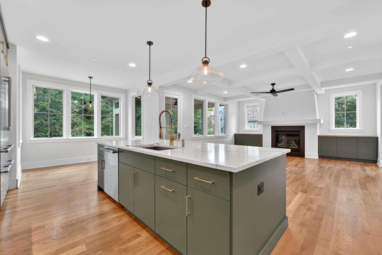 One open sight line from island to fireplace. You're cooking and you're still in the conversation.