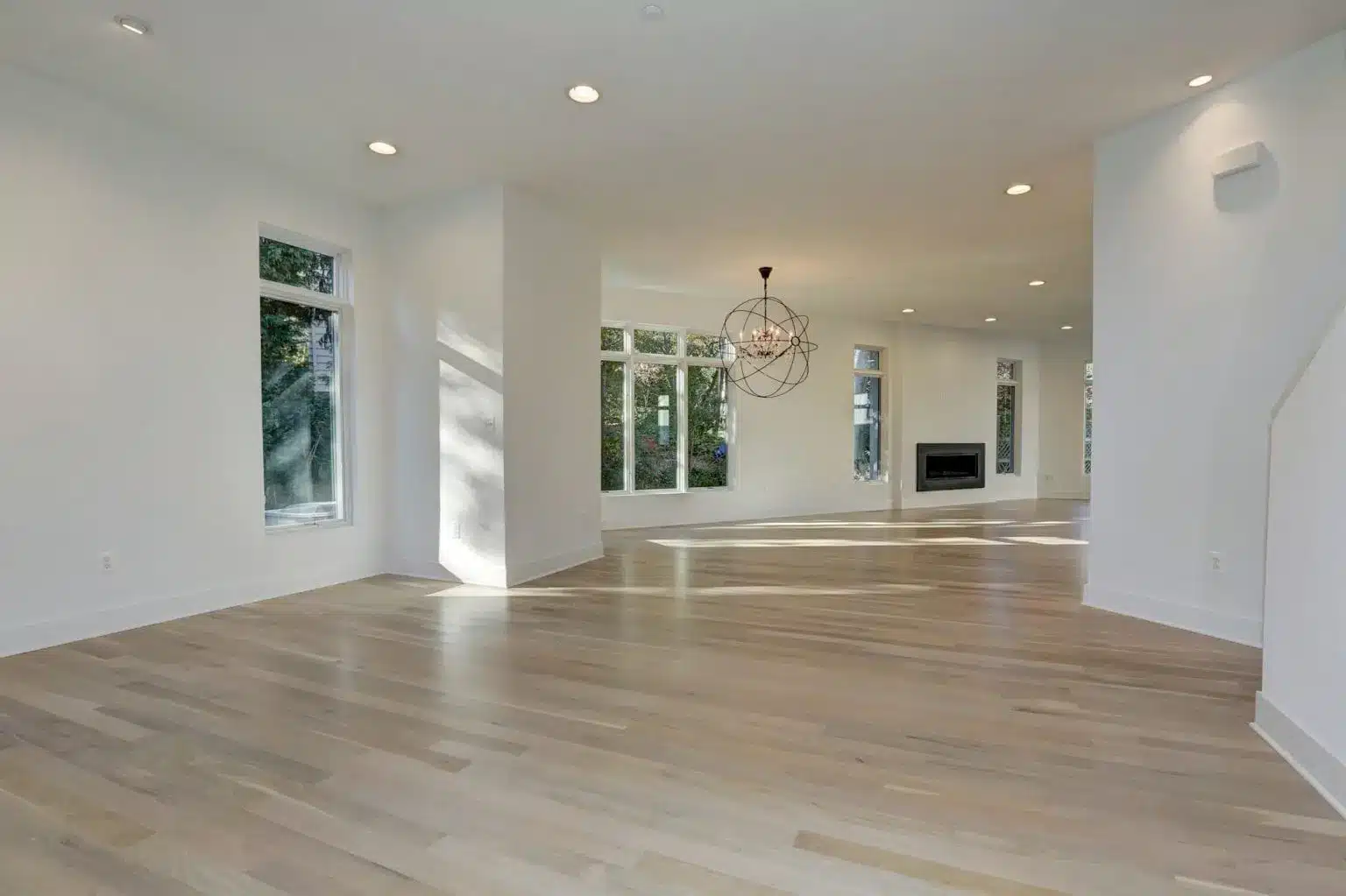 Sun cuts across the floor before furniture ever will