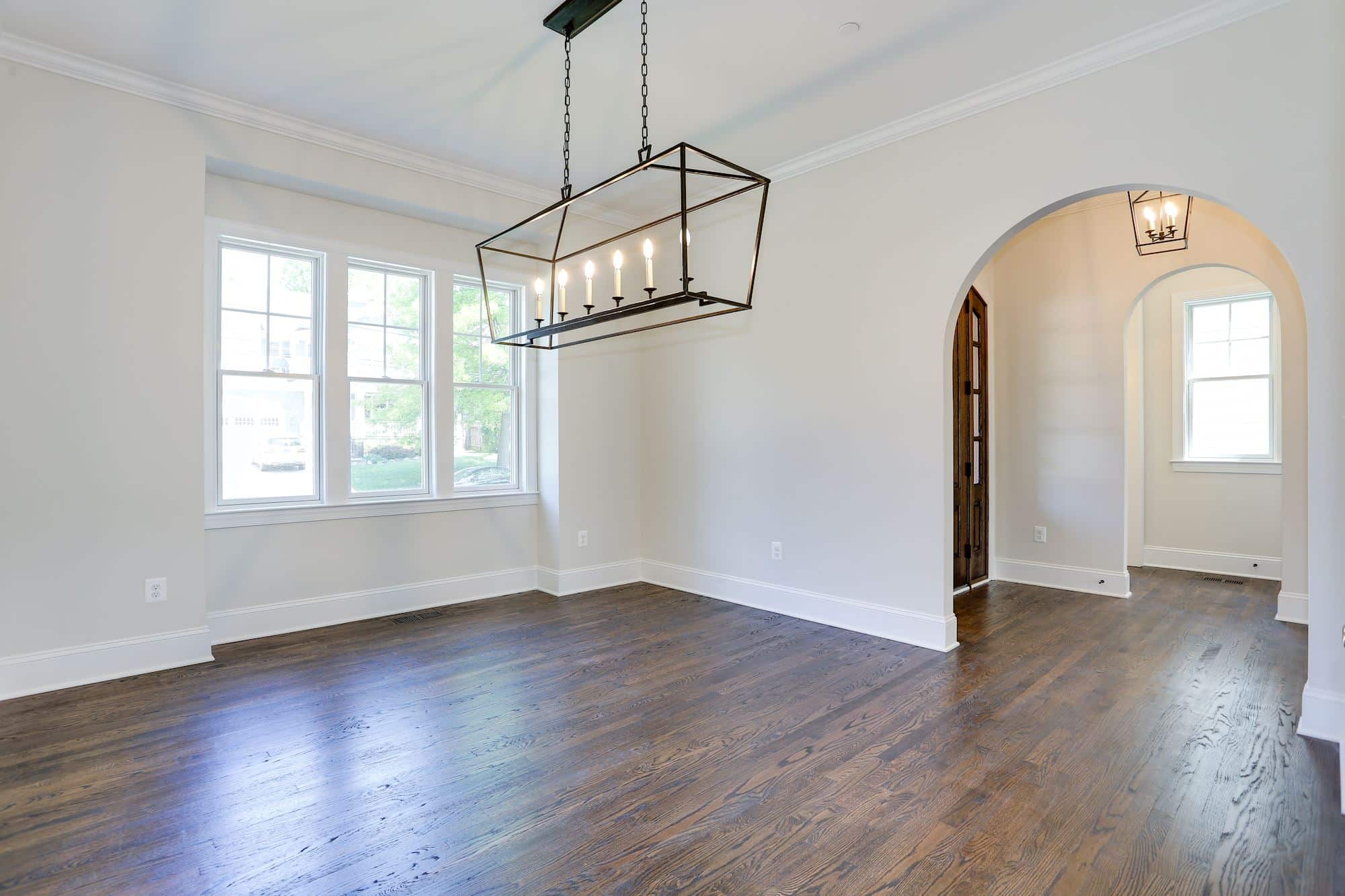 Arch frames the next room, light does the rest.