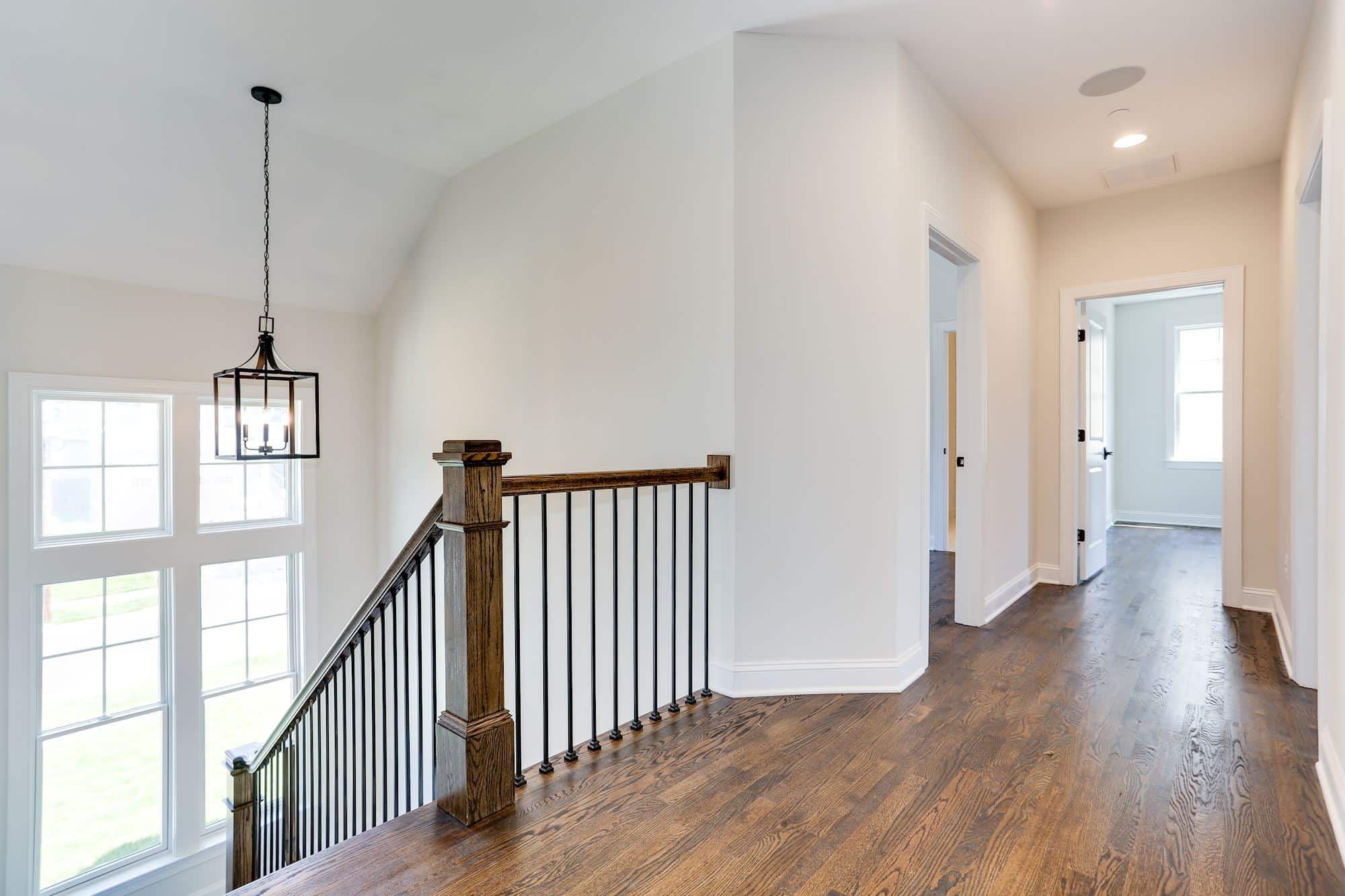 Upper hall landing - light from below, rooms branch off with ease.