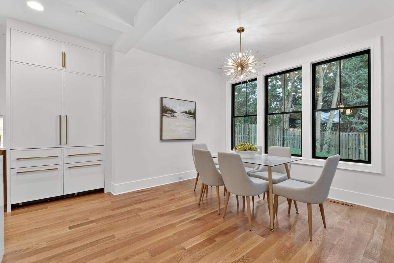 Sputnik pendant, black-framed windows. The everyday table.