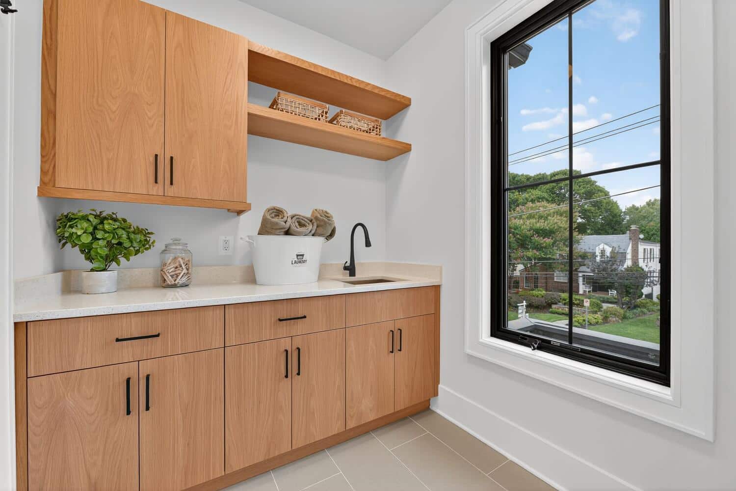 White oak cabinetry, open shelving. City views while folding.