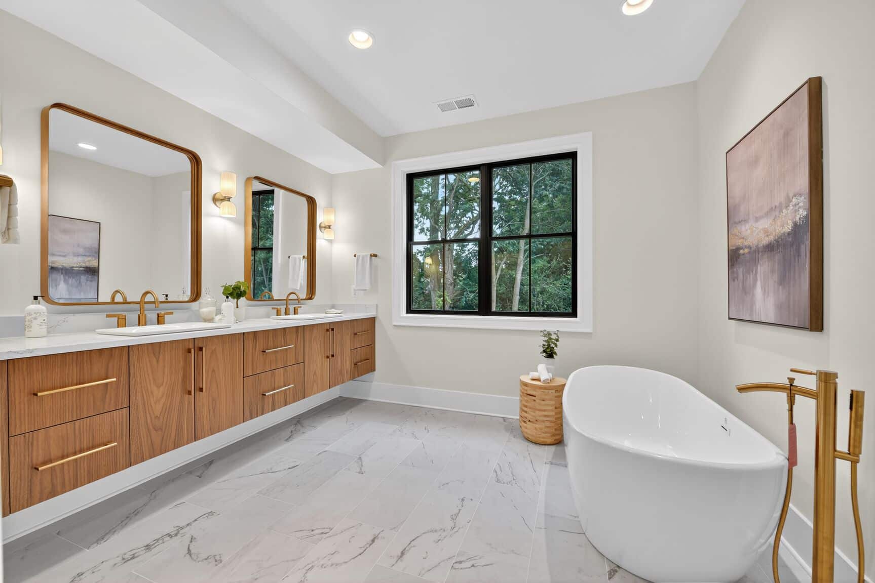 Freestanding tub, black-framed window. Earned square footage.