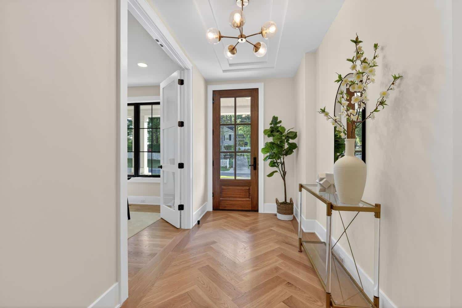 Herringbone underfoot, the entry earns its welcome.