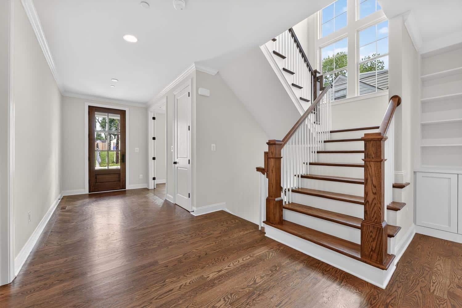Staircase anchors the whole entry