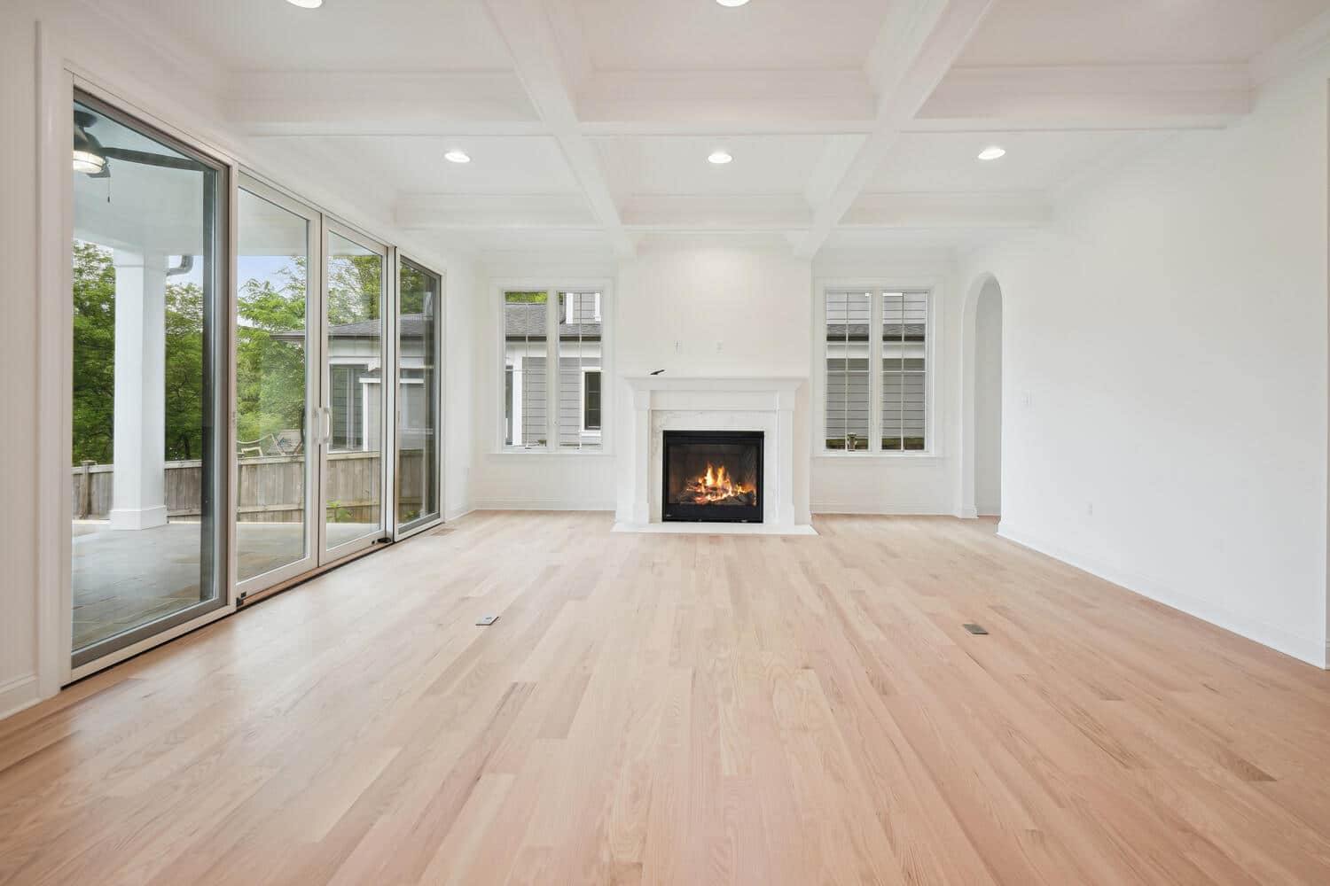 Sliding glass brings the outside in, fireplace holds the anchor