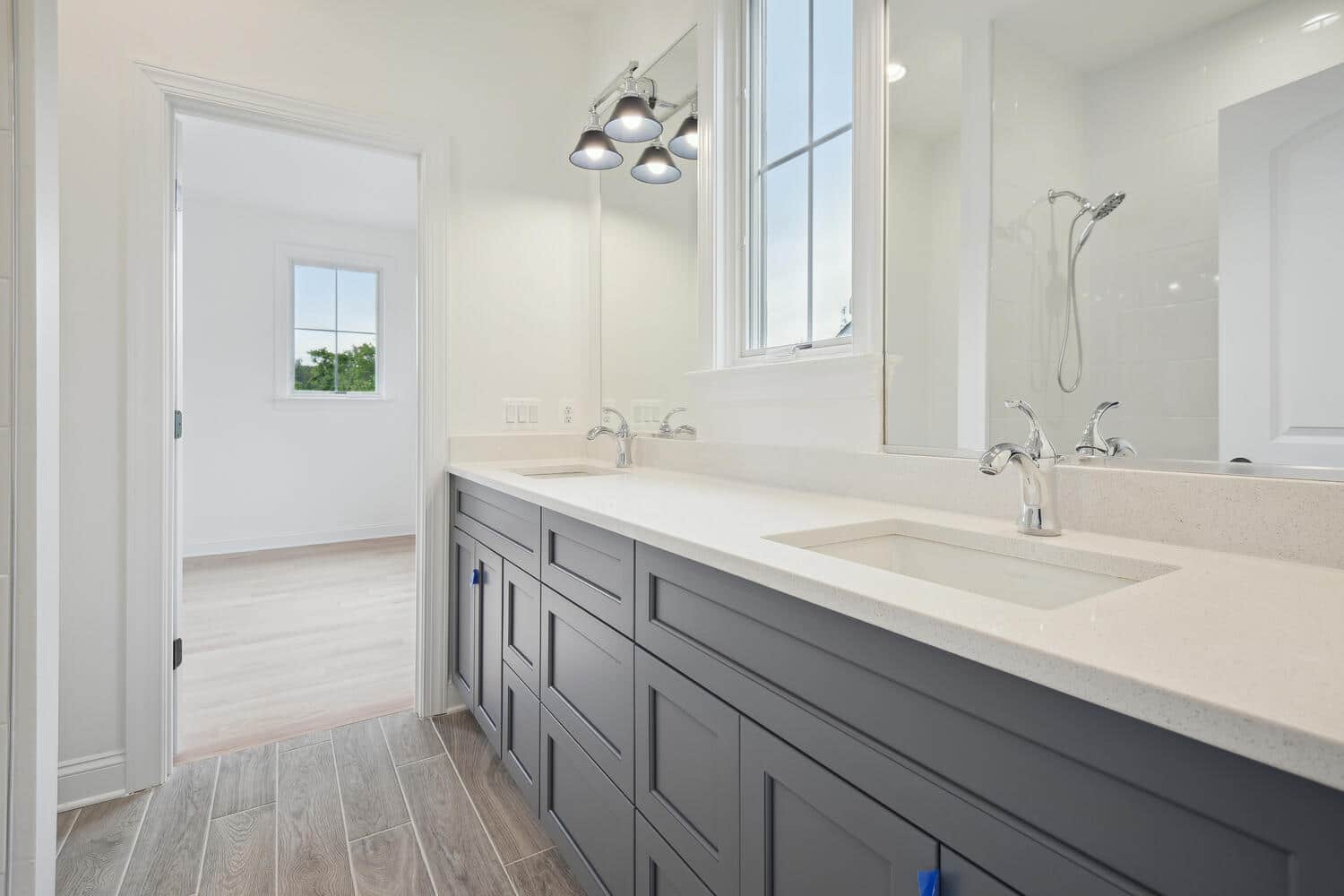 Double vanity runs the full length, window above