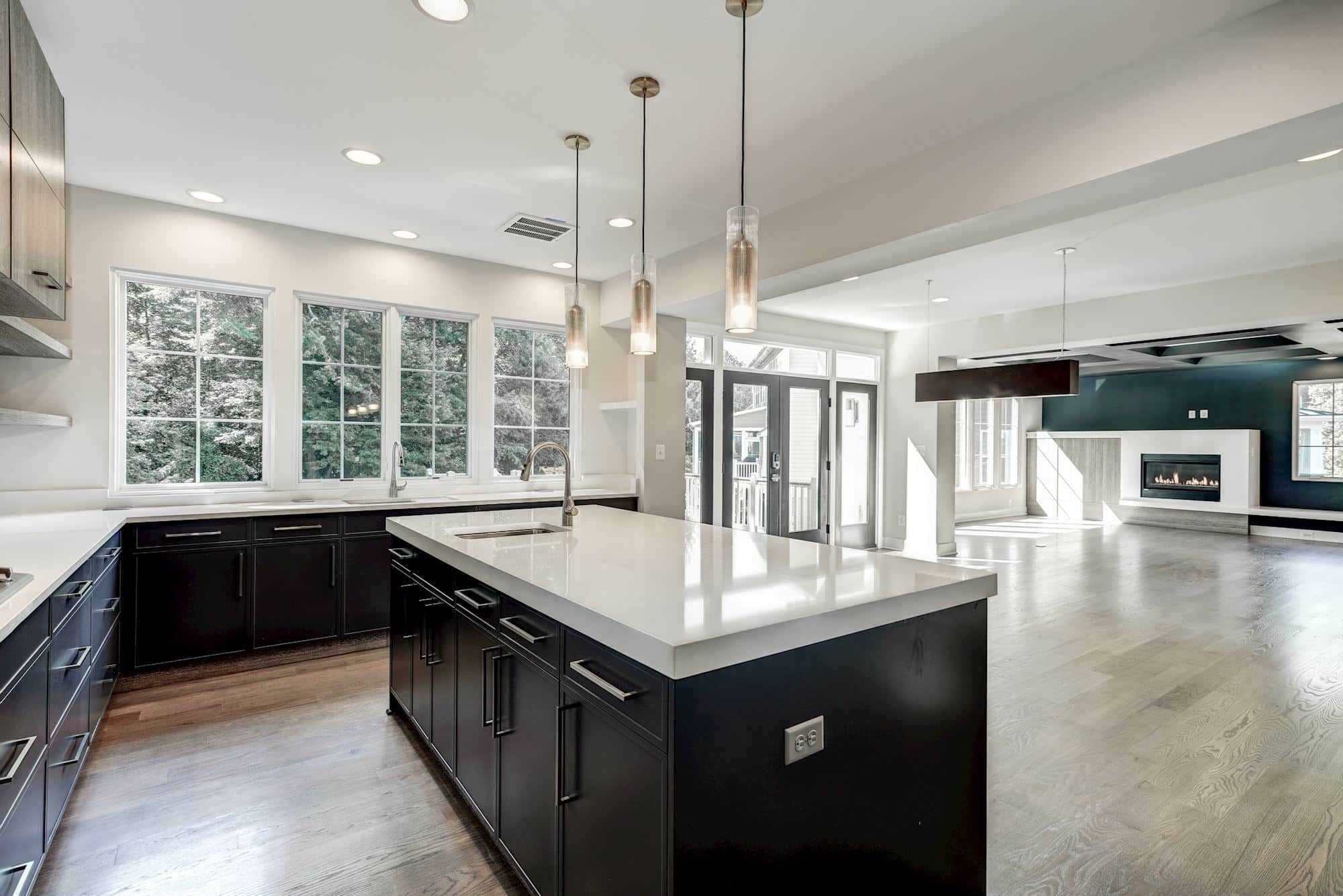 Island, cabinetry, fireplace - one sightline through